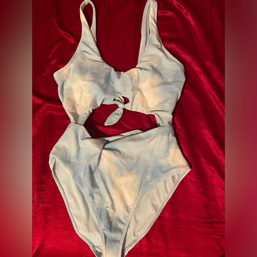 Swimsuit. Celebrity pink swim size XL. Blue and white cloud pattern with cutouts